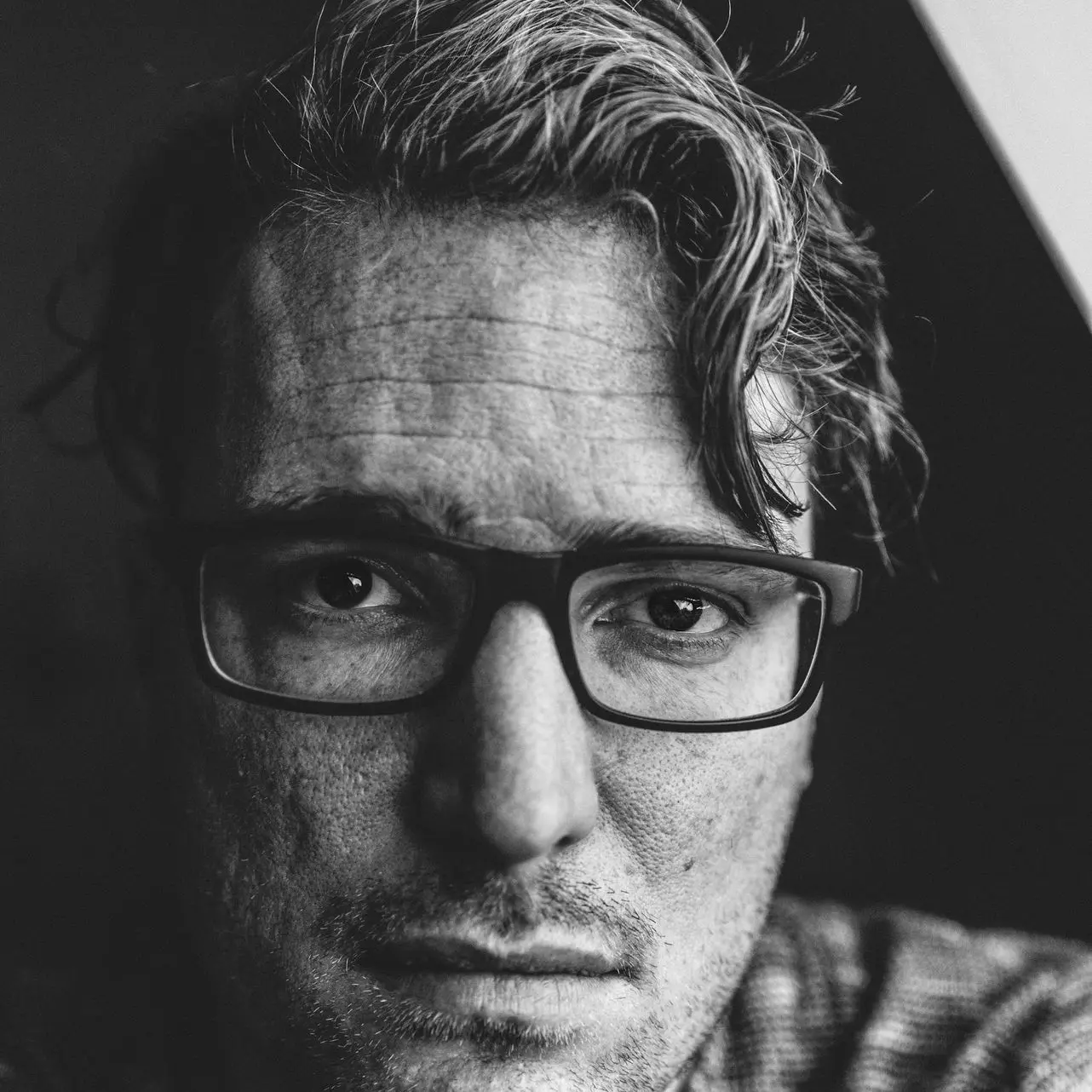grayscale photography of man taking selfie